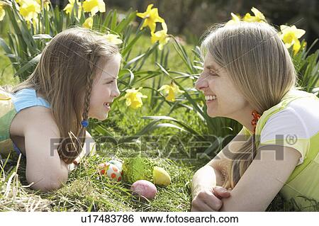 Mother And Daughter On Easter Egg Hunt In Daffodil Field View Large Photo Image Stock Photograph - Mother And Daughter On Easter Egg Hunt In Daffodil Field. Fotosearch