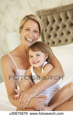 Mother And Daughter Relaxing In Bedroom View Large Photo Image Stock Photo - Mother And Daughter Relaxing In Bedroom. Fotosearch