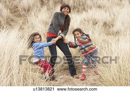 Mother And Daughters Having Fun In Sand Dunes View Large Photo Image Stock Image - Mother And Daughters Having Fun In Sand Dunes. Fotosearch