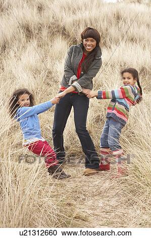 Mother And Daughters Having Fun In Sand Dunes View Large Photo Image Stock Image - Mother And Daughters Having Fun In Sand Dunes. Fotosearch