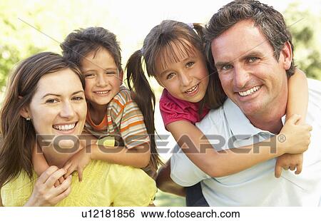 Mother And Father Giving Children Piggy Back View Large Photo Image Stock Photograph - Mother And Father Giving Children Piggy Back. Fotosearch