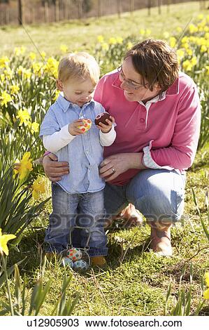 Mother And Son On Easter Egg Hunt In Daffodil Field View Large Photo Image Stock Image - Mother And Son On Easter Egg Hunt In Daffodil Field. Fotosearch