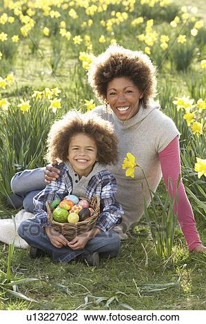 Mother And Son On Easter Egg Hunt In Daffodil Field View Large Photo Image Stock Image - Mother And Son On Easter Egg Hunt In Daffodil Field. Fotosearch