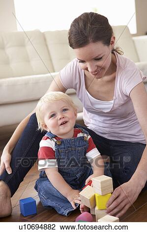 Mother And Son Playing With Coloured Blocks At Home View Large Photo Image Stock Image - Mother And Son Playing With Coloured Blocks At Home. Fotosearch