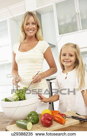 Mother & Daughter Preparing Salad In Modern Kitchen View Large Photo Image Stock Photography - Mother & Daughter Preparing Salad In Modern Kitchen. Fotosearch
