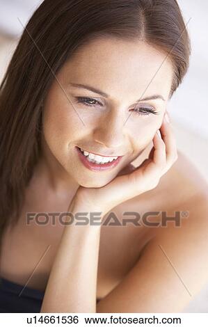 Stock Photograph - Portrait Of Attractive Young Woman. Fotosearch