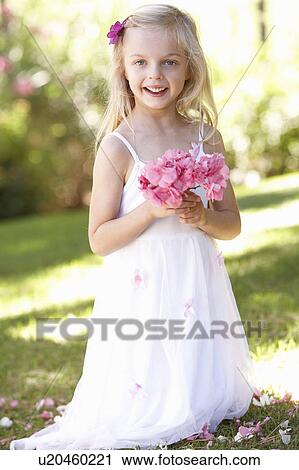 Portrait Of Bridesmaid Holding Bouquet Outdoors View Large Photo Image Stock Image - Portrait Of Bridesmaid Holding Bouquet Outdoors. Fotosearch