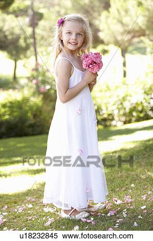 Portrait Of Bridesmaid Holding Bouquet Outdoors View Large Photo Image Stock Photography - Portrait Of Bridesmaid Holding Bouquet Outdoors. Fotosearch