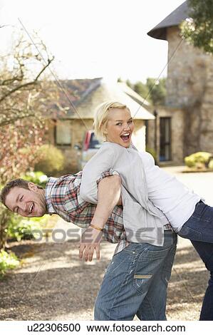 Stock Image - Portrait Of Energetic Young Couple Having Fun. Fotosearch