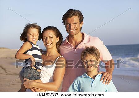 Stock Photo - Portrait Of Family On Beach Holiday. Fotosearch