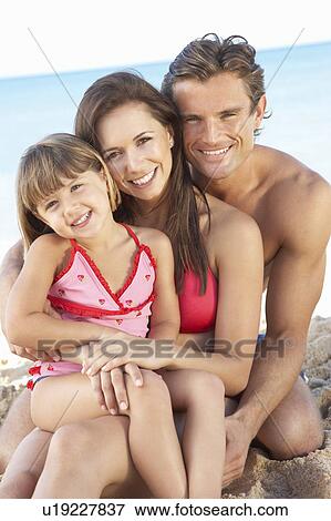 Stock Photo - Portrait Of Family On Summer Beach Holiday. Fotosearch