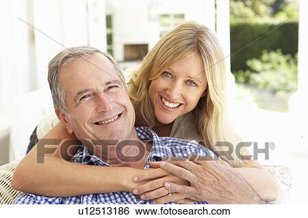 Portrait Of Father And Adult Daughter Relaxing On Sofa View Large Photo Image Stock Photograph - Portrait Of Father And Adult Daughter Relaxing On Sofa. Fotosearch