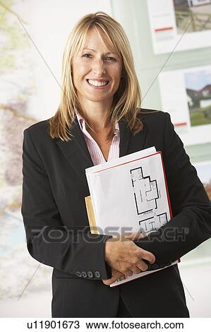 Portrait Of Female Estate Agent In Office View Large Photo Image Stock Image - Portrait Of Female Estate Agent In Office. Fotosearch