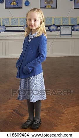 Portrait Of Female Primary School Pupil Standing In Classroom View Large Photo Image Picture - Portrait Of Female Primary School Pupil Standing In Classroom. Fotosearch