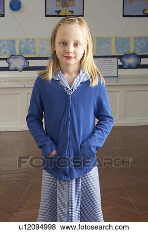 Portrait Of Female Primary School Pupil Standing In Classroom View Large Photo Image Stock Photo - Portrait Of Female Primary School Pupil Standing In Classroom. Fotosearch