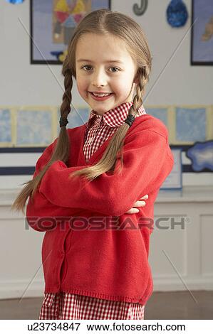 Portrait Of Female Primary School Pupil Standing In Classroom View Large Photo Image Stock Photo - Portrait Of Female Primary School Pupil Standing In Classroom. Fotosearch