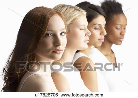Stock Photograph - Portrait Of Four Attractive Young Women In Studio Standing In Line. Fotosearch