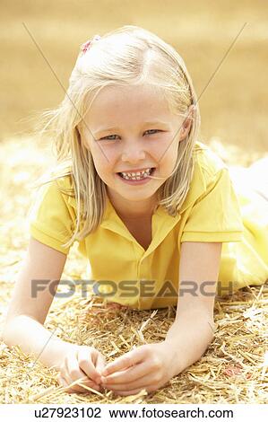 Portrait Of Girl Laying In Summer Harvested Field View Large Photo Image Stock Image - Portrait Of Girl Laying In Summer Harvested Field. Fotosearch