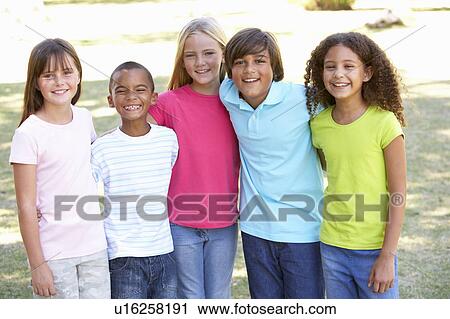 Stock Image - Portrait Of Group Of Children Playing In Park. Fotosearch