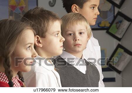 Portrait Of Group Of Primary Schoolchildren Standing In Classroom View Large Photo Image Stock Photo - Portrait Of Group Of Primary Schoolchildren Standing In Classroom. Fotosearch