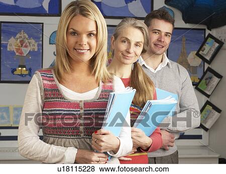 Stock Photo - Portrait Of Group Of Teachers In Classroom. Fotosearch