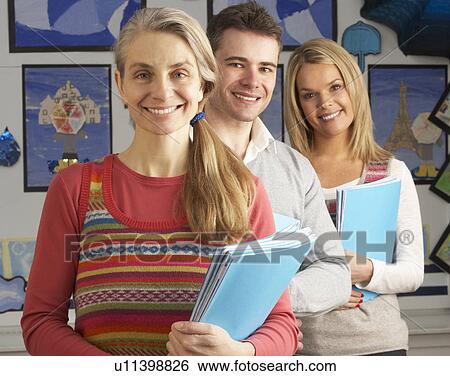 Stock Photograph - Portrait Of Group Of Teachers In Classroom. Fotosearch