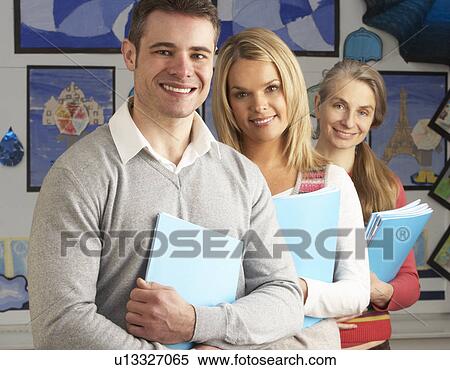 Stock Photography - Portrait Of Group Of Teachers In Classroom. Fotosearch