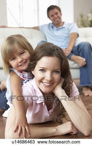Portrait Of Happy Family Relaxing At Home View Large Photo Image Stock Image - Portrait Of Happy Family Relaxing At Home. Fotosearch