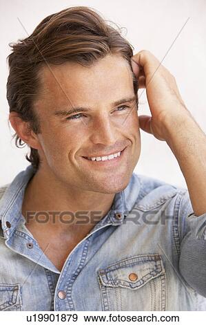 Stock Photo - Portrait Of Happy Young Man. Fotosearch