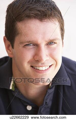 Stock Photo - Portrait Of Happy Young Man. Fotosearch