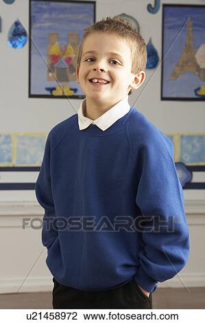 Portrait Of Male Primary School Pupil Standing In Classroom View Large Photo Image Stock Image - Portrait Of Male Primary School Pupil Standing In Classroom. Fotosearch