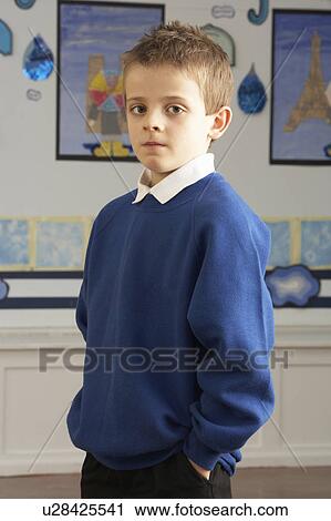 Portrait Of Male Primary School Pupil Standing In Classroom View Large Photo Image Stock Image - Portrait Of Male Primary School Pupil Standing In Classroom. Fotosearch