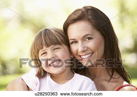 Portrait Of Mother And Child Relaxing In Park View Large Photo Image Stock Image - Portrait Of Mother And Child Relaxing In Park. Fotosearch