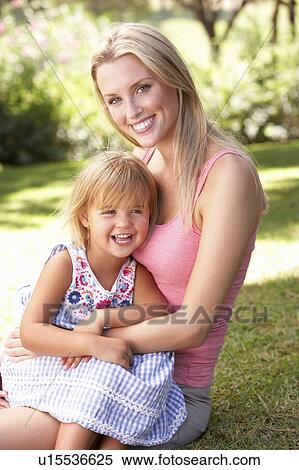 Portrait Of Mother And Child Relaxing In Park View Large Photo Image Stock Photography - Portrait Of Mother And Child Relaxing In Park. Fotosearch