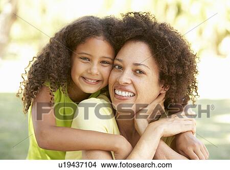 Picture - Portrait Of Mother And Daughter In Park. Fotosearch