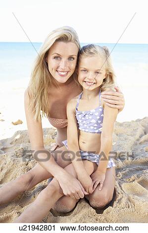 Stock Image - Portrait Of Mother And Daughter On Summer Beach Holiday. Fotosearch