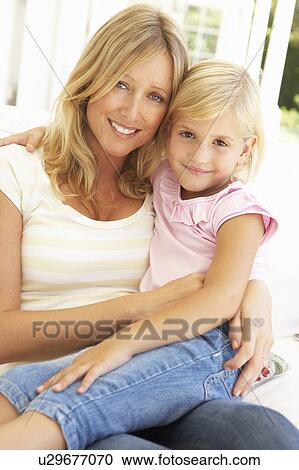 Portrait Of Mother And Daughter Relaxing On Sofa View Large Photo Image Stock Image - Portrait Of Mother And Daughter Relaxing On Sofa. Fotosearch