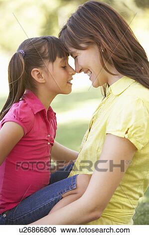 Portrait Of Mother And Daughter Together In Park View Large Photo Image Stock Photograph - Portrait Of Mother And Daughter Together In Park. Fotosearch