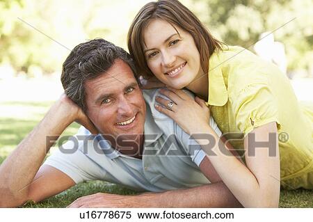 Stock Photography - Portrait Of Romantic Couple In Park. Fotosearch