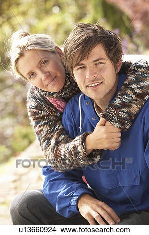Portrait Of Romantic Young Couple In Autumn Park View Large Photo Image Picture - Portrait Of Romantic Young Couple In Autumn Park. Fotosearch