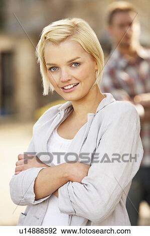 Stock Image - Portrait Of Romantic Young Couple Embracing. Fotosearch