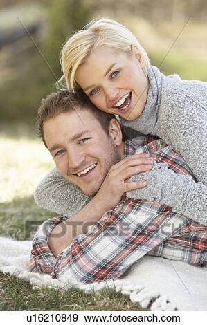Portrait Of Romantic Young Lying On Grass View Large Photo Image Stock Photo - Portrait Of Romantic Young Lying On Grass. Fotosearch