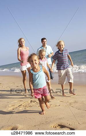 Portrait Of Running Family On Beach Holiday View Large Photo Image Stock Photograph - Portrait Of Running Family On Beach Holiday . Fotosearch