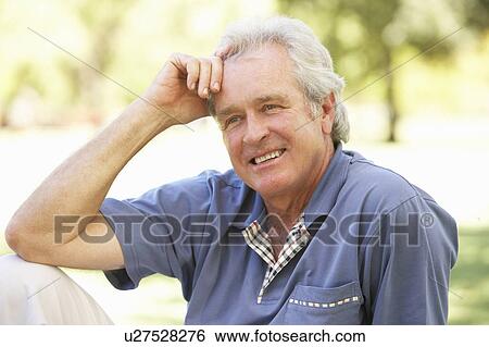 Stock Photograph - Portrait Of Senior Man In Park. Fotosearch