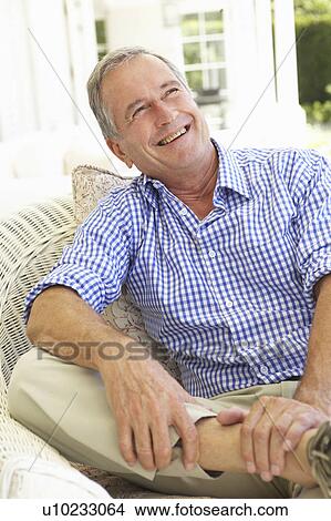 Picture - Portrait Of Senior Man Relaxing In Chair. Fotosearch