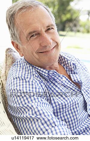Portrait Of Senior Man Relaxing In Chair View Large Photo Image Stock Photo - Portrait Of Senior Man Relaxing In Chair. Fotosearch