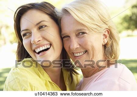 Stock Image - Portrait Of Senior Woman With Adult Daughter. Fotosearch