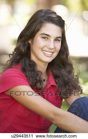 Portrait Of Teenage Girl Sitting In Park View Large Photo Image Stock Image - Portrait Of Teenage Girl Sitting In Park. Fotosearch