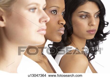 Portrait Of Three Attractive Young Women In Studio Standing In Line View Large Photo Image Picture - Portrait Of Three Attractive Young Women In Studio Standing In Line. Fotosearch