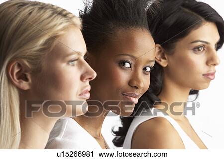 Portrait Of Three Attractive Young Women In Studio Standing In Line View Large Photo Image Stock Image - Portrait Of Three Attractive Young Women In Studio Standing In Line. Fotosearch